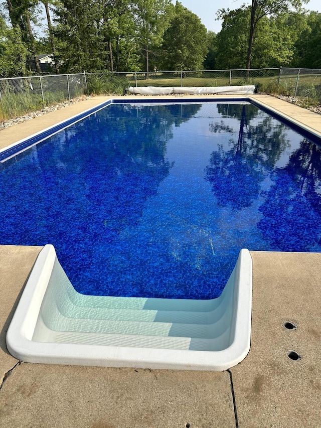 11199 Edgewood Rd, Bellevue, MI 49021 - view of swimming pool with view of scattered trees