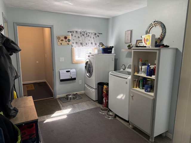 11199 Edgewood Rd, Bellevue, MI 49021 - washroom with washer and dryer and wood finished floors