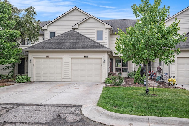 3395 Breckland Ct, Ann Arbor, MI 48108 - traditional-style home featuring a garage, roof with shingles, and driveway