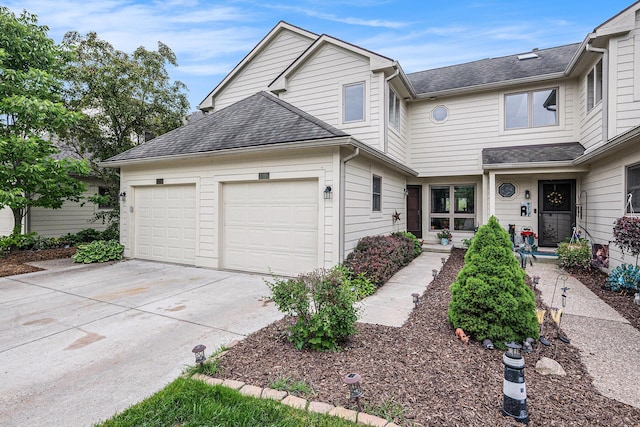 3395 Breckland Ct, Ann Arbor, MI 48108 - view of front of home with concrete driveway, an attached garage, and roof with shingles