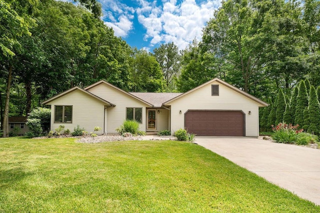 3999 Ravina Ter, Saint Joseph, MI 49085 - ranch-style home featuring a garage, concrete driveway, and a front yard