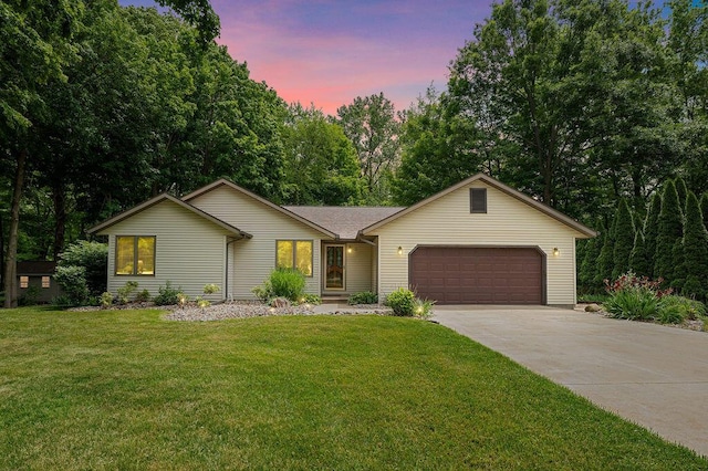 3999 Ravina Ter, Saint Joseph, MI 49085 - ranch-style house with an attached garage, concrete driveway, and a front lawn