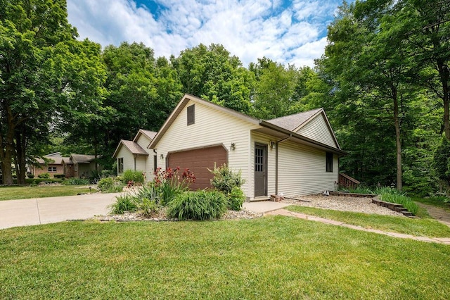 3999 Ravina Ter, Saint Joseph, MI 49085 - ranch-style house featuring a garage, driveway, and a front yard