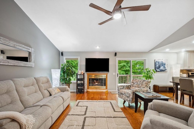 3999 Ravina Ter, Saint Joseph, MI 49085 - living area featuring vaulted ceiling, light wood-type flooring, a glass covered fireplace, ceiling fan, and recessed lighting