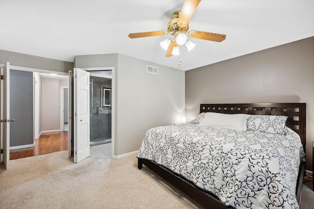 3999 Ravina Ter, Saint Joseph, MI 49085 - bedroom featuring carpet flooring, a ceiling fan, and ensuite bathroom