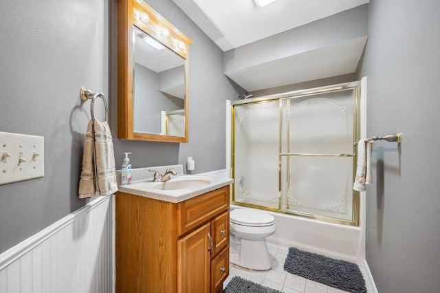 3999 Ravina Ter, Saint Joseph, MI 49085 - bathroom featuring vanity, bath / shower combo with glass door, and tile patterned floors