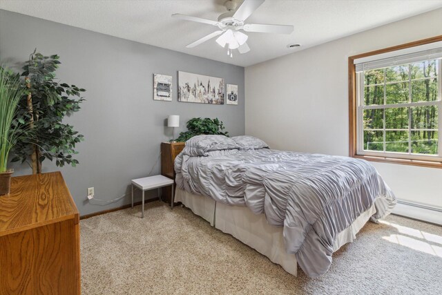 10343 N Walnut Ave, Bitely, MI 49309 - bedroom with light carpet and ceiling fan