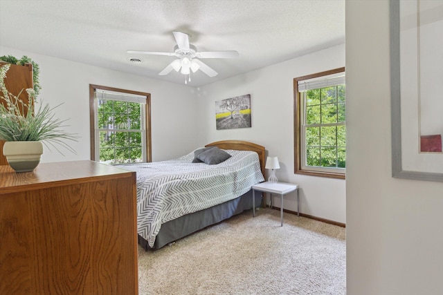 10343 N Walnut Ave, Bitely, MI 49309 - carpeted bedroom featuring baseboards and a ceiling fan