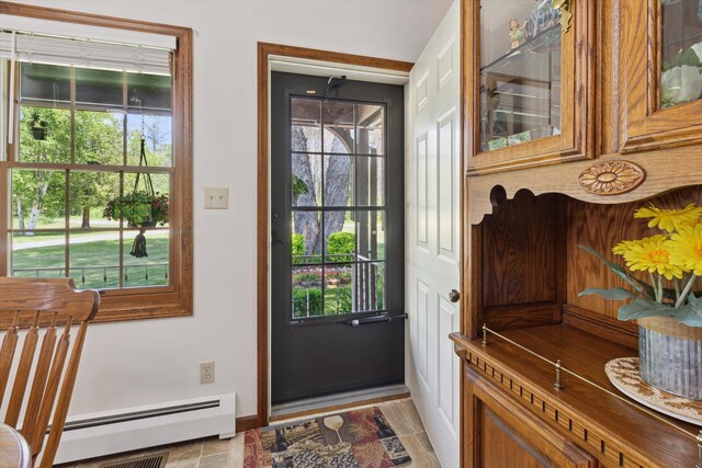 10343 N Walnut Ave, Bitely, MI 49309 - entryway with a baseboard heating unit and healthy amount of natural light