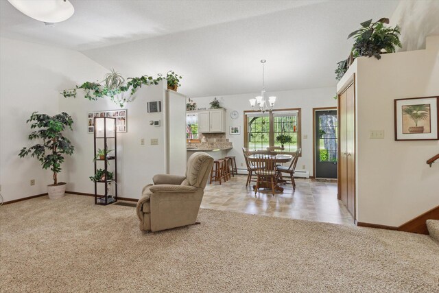 10343 N Walnut Ave, Bitely, MI 49309 - living room with a chandelier, vaulted ceiling, light carpet, and a baseboard heating unit