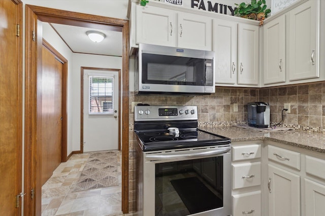 10343 N Walnut Ave, Bitely, MI 49309 - kitchen featuring appliances with stainless steel finishes, tasteful backsplash, and white cabinetry