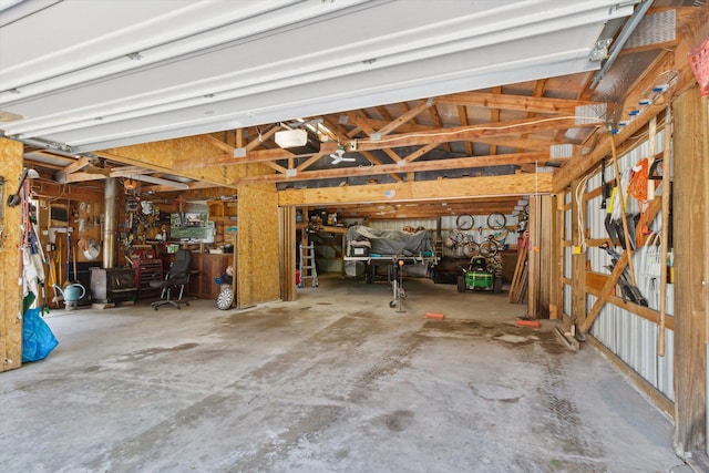 10343 N Walnut Ave, Bitely, MI 49309 - garage with a workshop area and a garage door opener