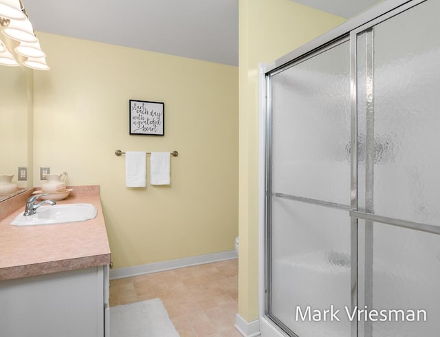 13497 Hidden Creek Ct, Grand Haven, MI 49417 - full bathroom featuring vanity and a stall shower