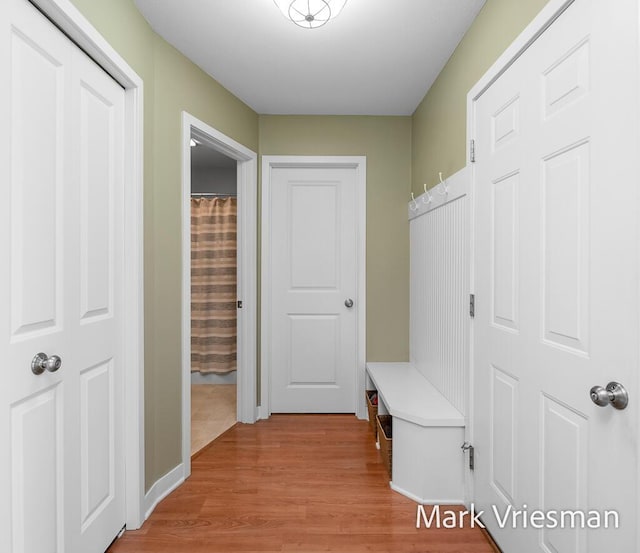 13497 Hidden Creek Ct, Grand Haven, MI 49417 - mudroom featuring light wood finished floors and baseboards