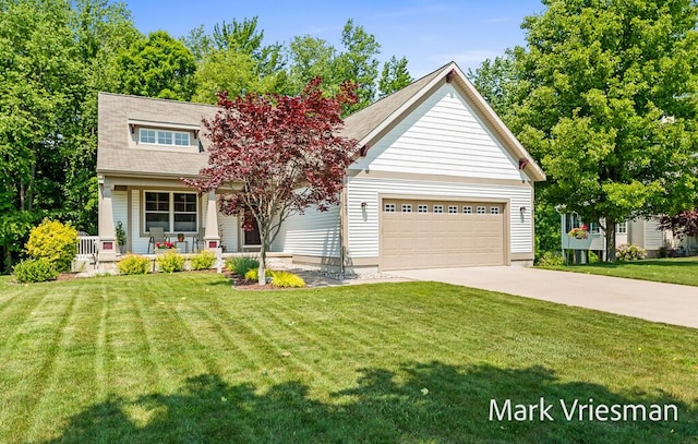 13497 Hidden Creek Ct, Grand Haven, MI 49417 - view of front of property with a porch, driveway, a front yard, and a garage