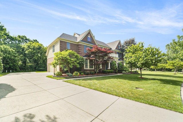 2032 Cameo Ct, Canton, MI 48187 - view of front facade featuring a garage, driveway, a front lawn, and brick siding