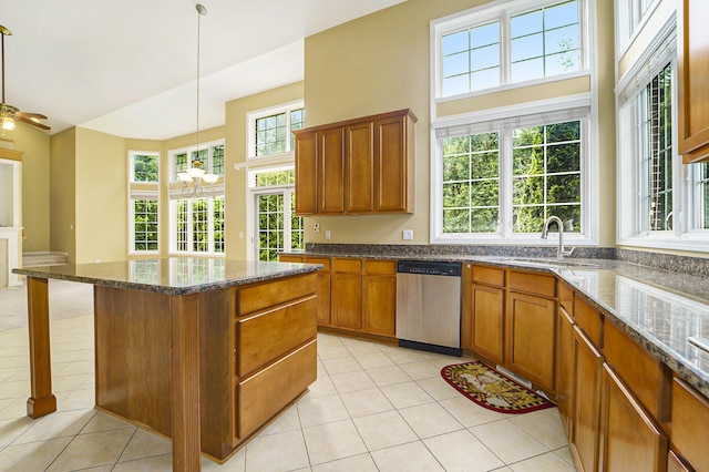 2032 Cameo Ct, Canton, MI 48187 - kitchen with dishwasher, a center island, light tile patterned flooring, brown cabinets, and a high ceiling