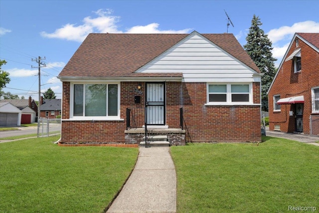 20401 Anglin St, Detroit, MI 48234 - bungalow featuring brick siding, a front yard, and a shingled roof