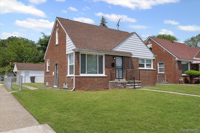 20401 Anglin St, Detroit, MI 48234 - bungalow-style house with brick siding, a garage, and roof with shingles