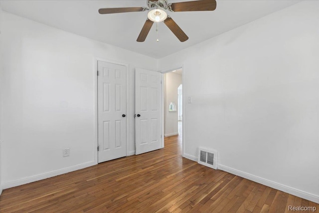 20401 Anglin St, Detroit, MI 48234 - unfurnished bedroom with wood finished floors, arched walkways, and a ceiling fan