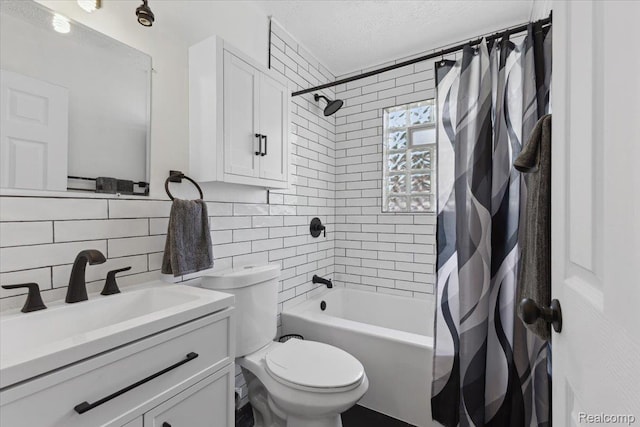 20401 Anglin St, Detroit, MI 48234 - full bathroom featuring shower / bath combo, vanity, backsplash, tile walls, and a textured ceiling