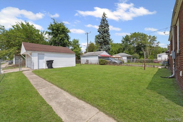 20401 Anglin St, Detroit, MI 48234 - view of yard featuring an outdoor structure and a garage