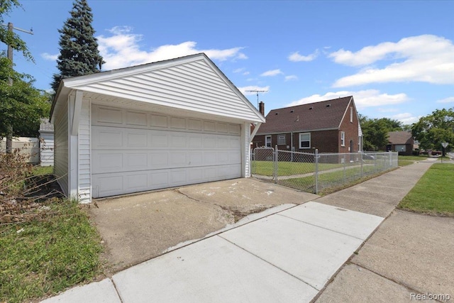 20401 Anglin St, Detroit, MI 48234 - view of front facade with an outbuilding and a garage