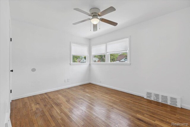 20401 Anglin St, Detroit, MI 48234 - spare room featuring wood-type flooring and ceiling fan