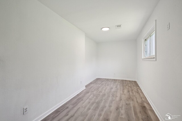 2131 Baldwin Rd, Monroe, MI 48162 - empty room featuring wood finished floors and baseboards