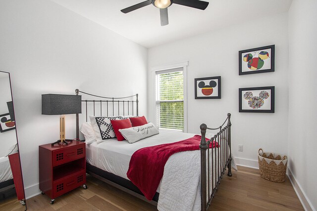 7285 Maple St, South Haven, MI 49090 - bedroom with wood finished floors and a ceiling fan