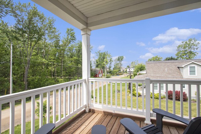 7285 Maple St, South Haven, MI 49090 - wooden deck featuring a lawn