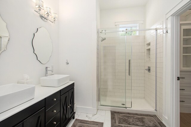 7285 Maple St, South Haven, MI 49090 - bathroom with a stall shower, double vanity, and marble finish floors