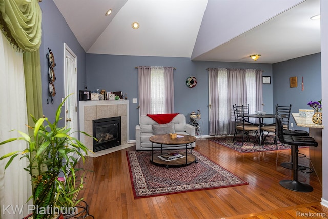 3167 Blackheath Ct, Port Huron, MI 48060 - living area with lofted ceiling, healthy amount of natural light, hardwood / wood-style flooring, and a fireplace