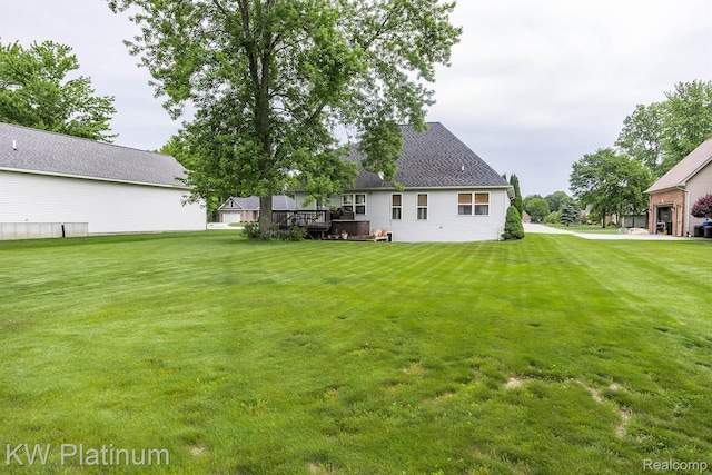 3167 Blackheath Ct, Port Huron, MI 48060 - rear view of house featuring a deck, a lawn, and roof with shingles