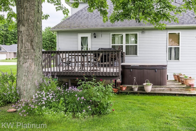 3167 Blackheath Ct, Port Huron, MI 48060 - rear view of property featuring a hot tub, a wooden deck, a shingled roof, and a yard