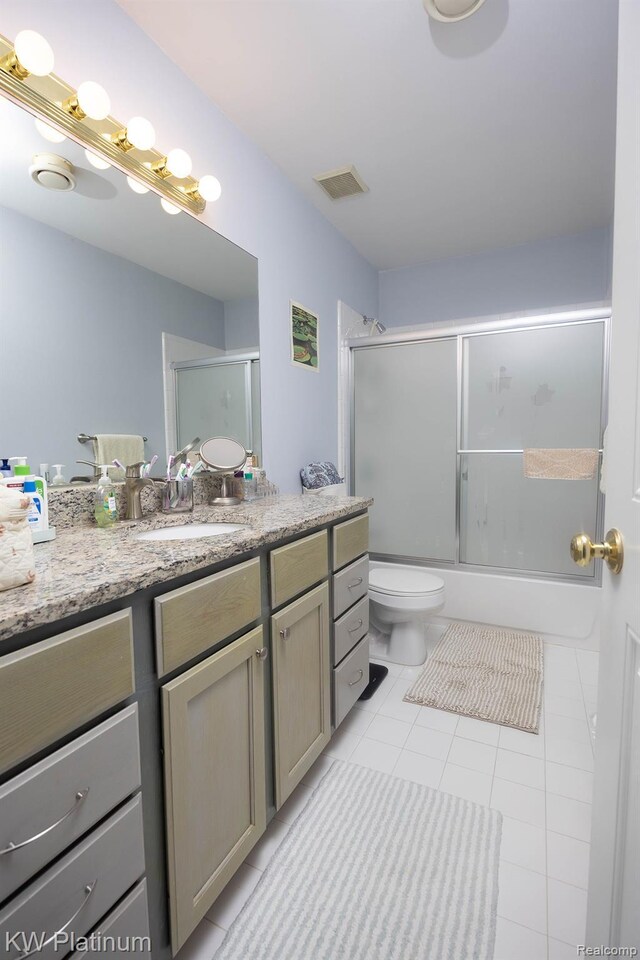 3167 Blackheath Ct, Port Huron, MI 48060 - bathroom featuring vanity, tile patterned flooring, and bath / shower combo with glass door