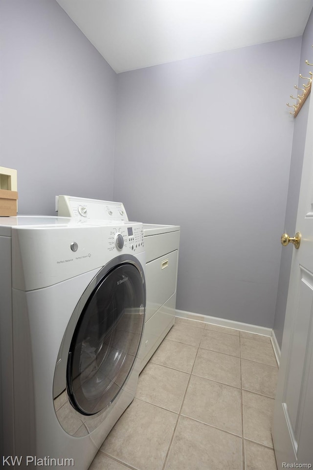 3167 Blackheath Ct, Port Huron, MI 48060 - laundry area featuring washer and clothes dryer and light tile patterned floors