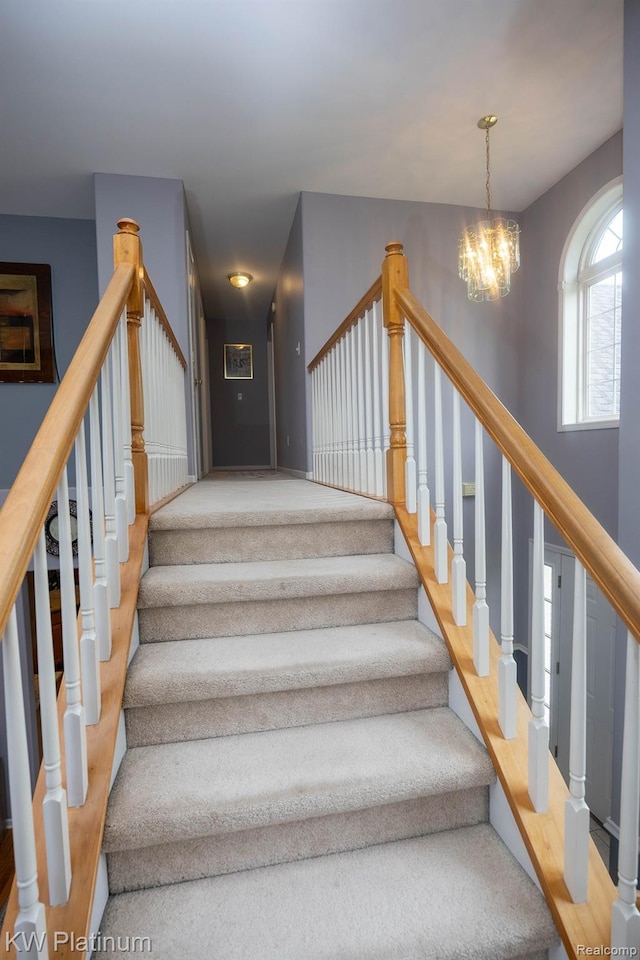 3167 Blackheath Ct, Port Huron, MI 48060 - stairway with a chandelier and carpet floors