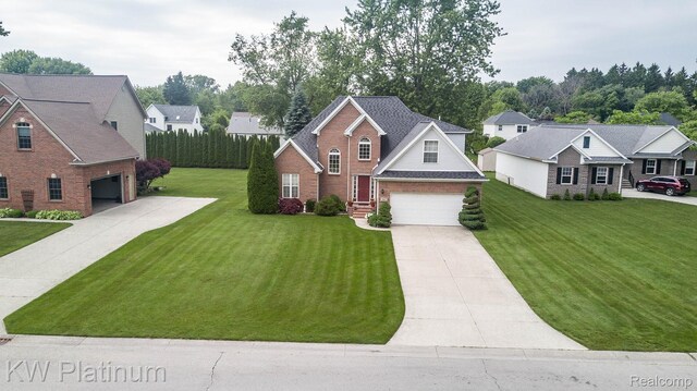 3167 Blackheath Ct, Port Huron, MI 48060 - traditional home featuring concrete driveway, brick siding, a front yard, and a residential view