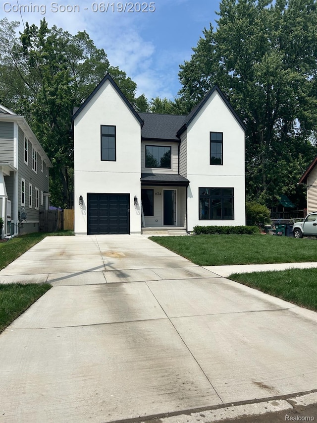 624 S Vermont Ave, Royal Oak, MI 48067 - modern farmhouse style home featuring an attached garage, driveway, stucco siding, and roof with shingles