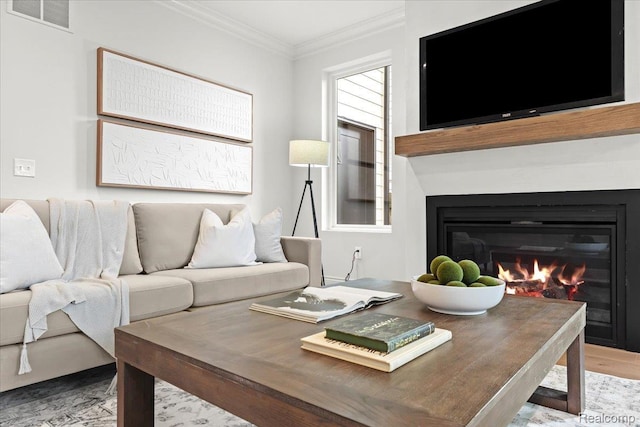 624 S Vermont Ave, Royal Oak, MI 48067 - living area with ornamental molding, a glass covered fireplace, and wood finished floors
