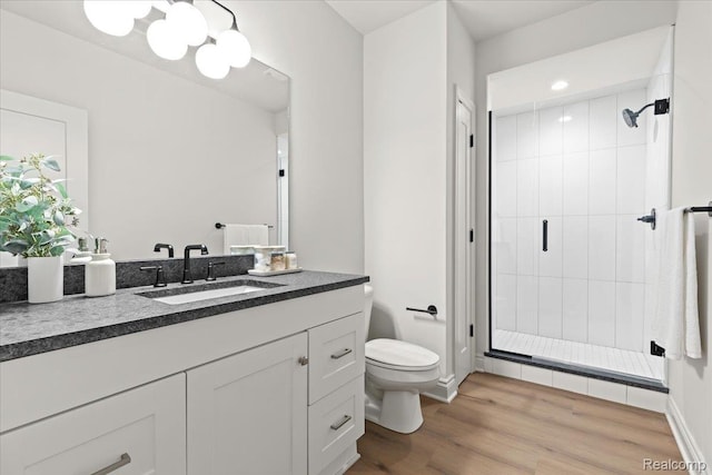 624 S Vermont Ave, Royal Oak, MI 48067 - full bathroom featuring a shower stall, vanity, wood finished floors, and recessed lighting