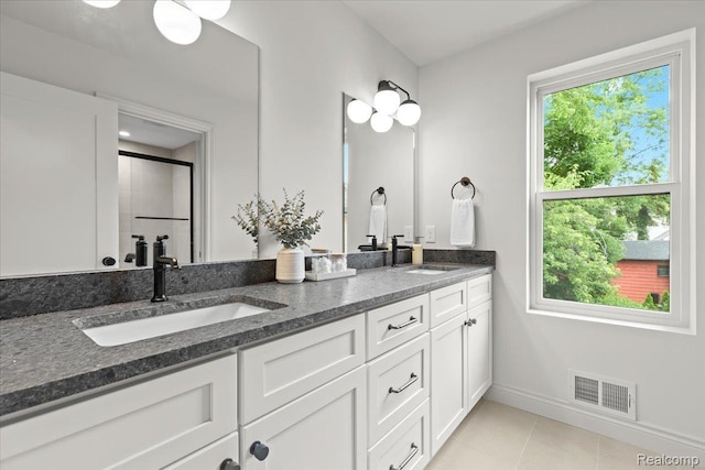 624 S Vermont Ave, Royal Oak, MI 48067 - bathroom with double vanity, tile patterned flooring, and a shower