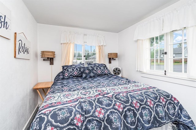 6276 W Houghton Lake Dr, Houghton Lake, MI 48629 - bedroom featuring multiple windows