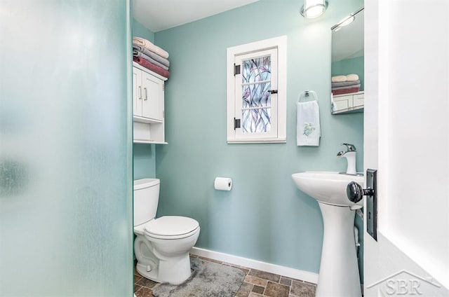 6276 W Houghton Lake Dr, Houghton Lake, MI 48629 - bathroom featuring stone finish flooring and a shower