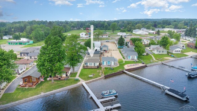 6276 W Houghton Lake Dr, Houghton Lake, MI 48629 - aerial perspective of suburban area with a nearby body of water