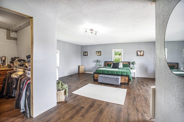 3463 Arthur Rd, Remus, MI 49340 - bedroom with wood finished floors and a textured ceiling