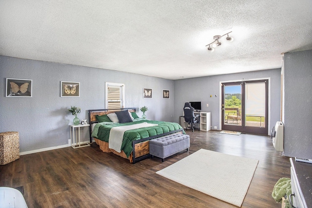 3463 Arthur Rd, Remus, MI 49340 - bedroom featuring a textured ceiling, access to outside, a textured wall, wood finished floors, and an office area