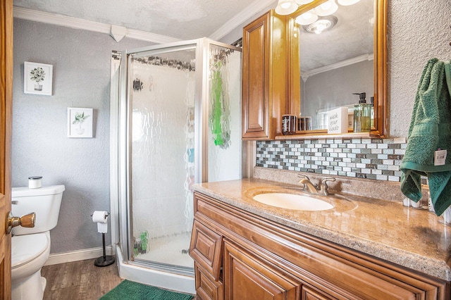 3463 Arthur Rd, Remus, MI 49340 - full bath featuring ornamental molding, a stall shower, vanity, wood finished floors, and decorative backsplash