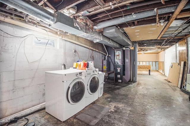 3463 Arthur Rd, Remus, MI 49340 - below grade area featuring washing machine and dryer, electric water heater, and heating unit